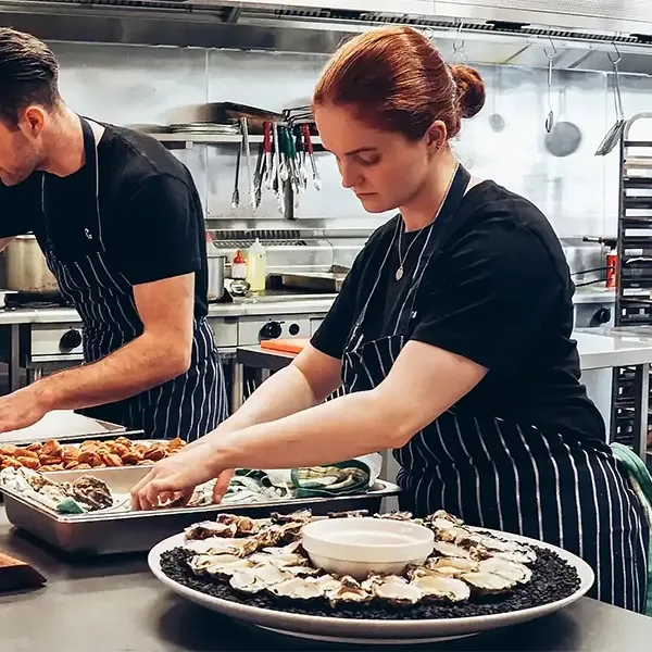 Cook and chefs getting the food ready for the daily service