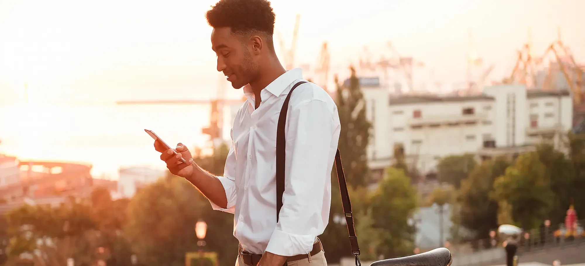 Restaurant guest checking his phone to read the restaurant SMS