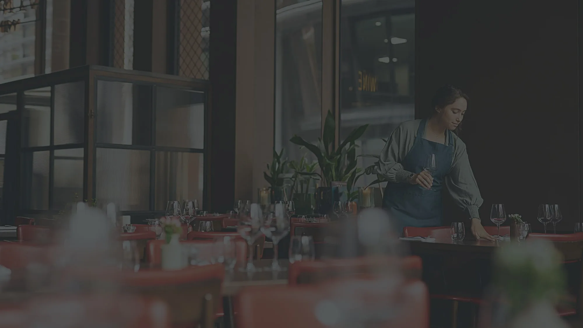 Restaurant owner expecting guests who made a reservation on the booking app