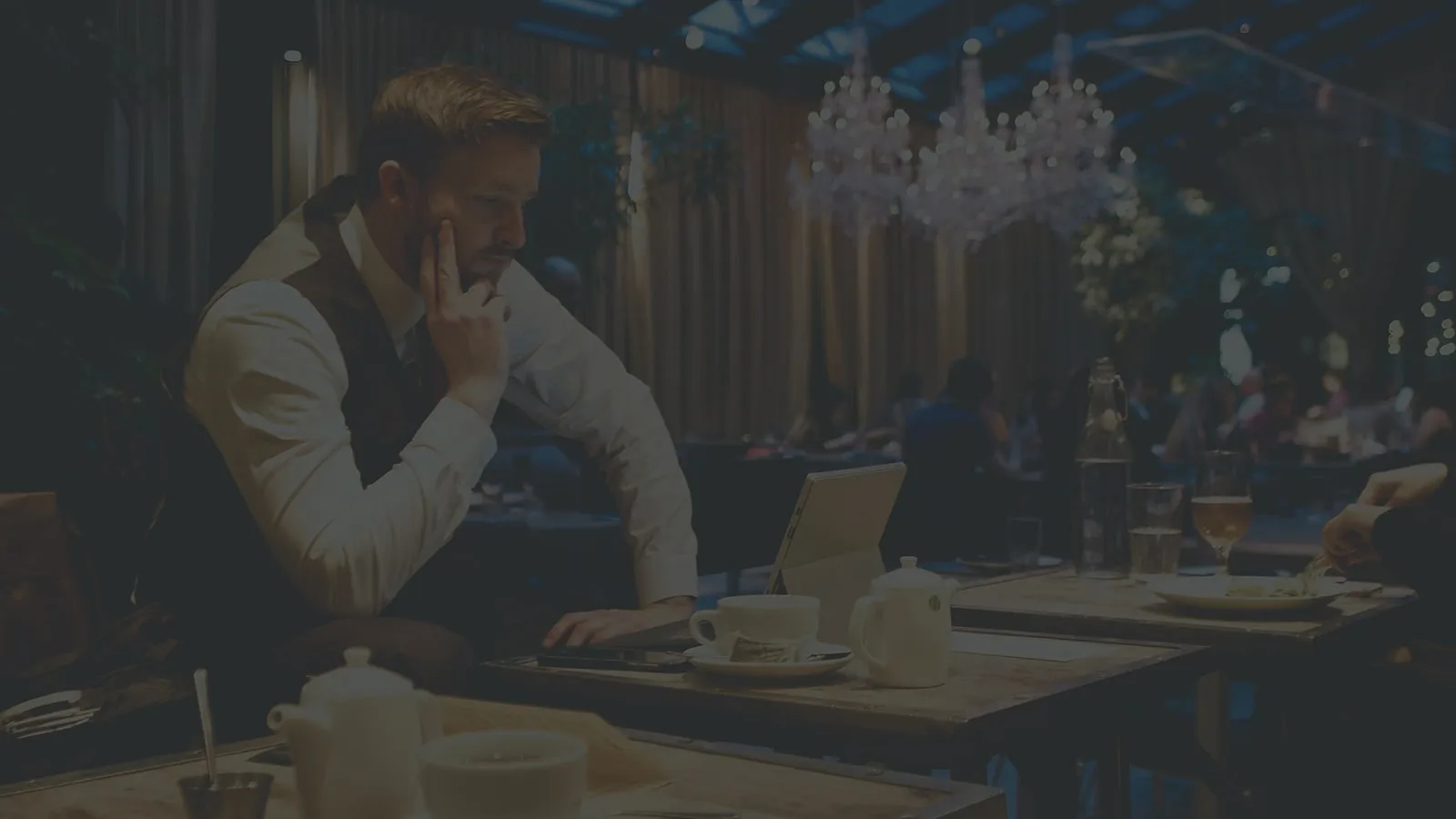 Restaurant owner calculating the real cost of using Opentable table management software