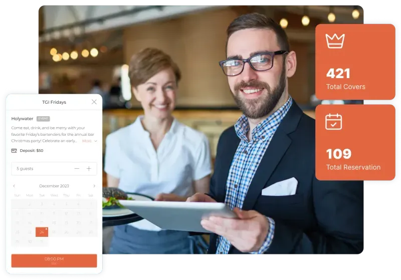 A businessman with a tablet is smiling, and a female photographer is standing next to him